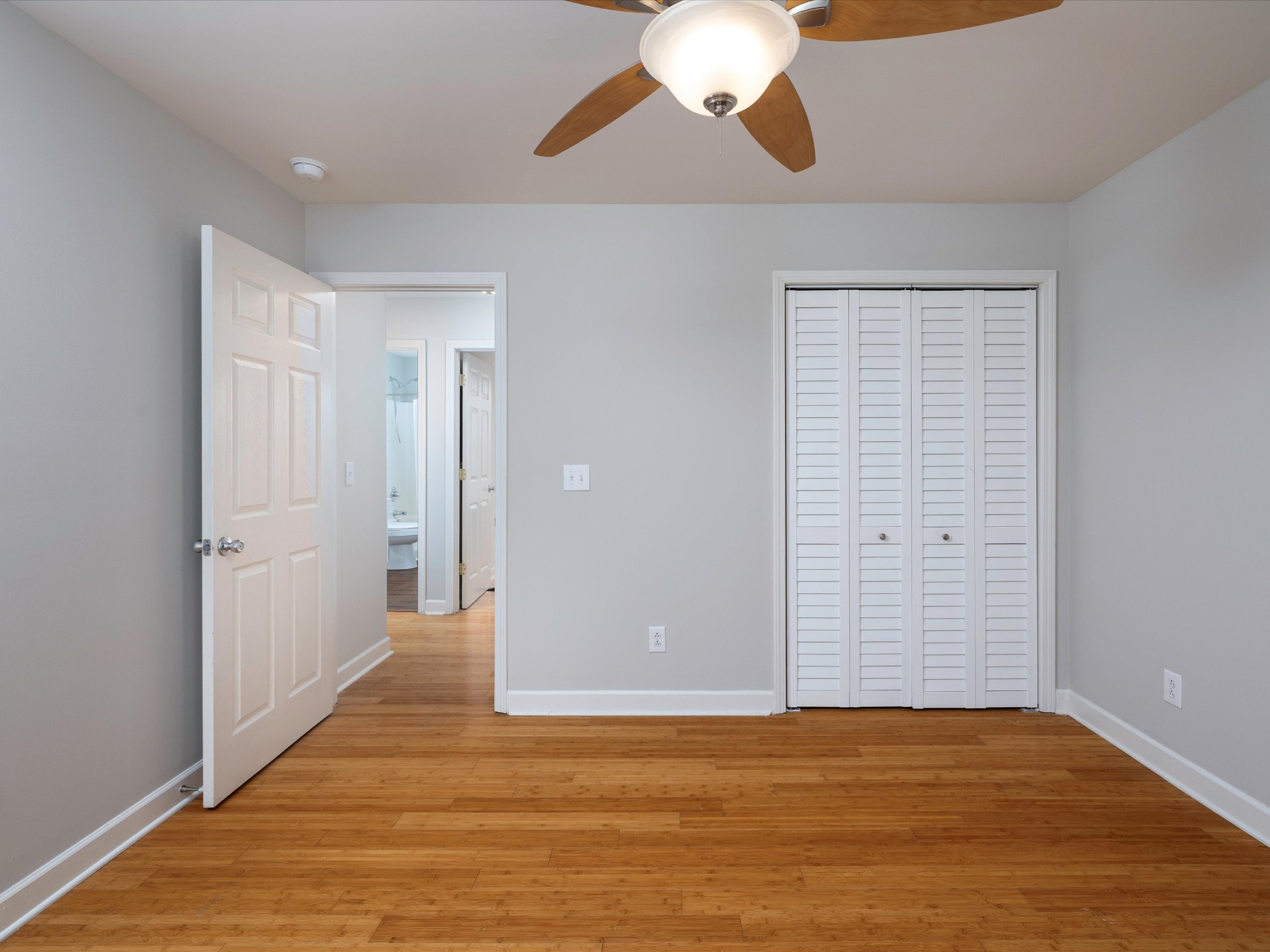 1007 Persimmon Drive Spring Hill, TN 37174 - Photo 22 of 44 a view of an empty room with wooden floor