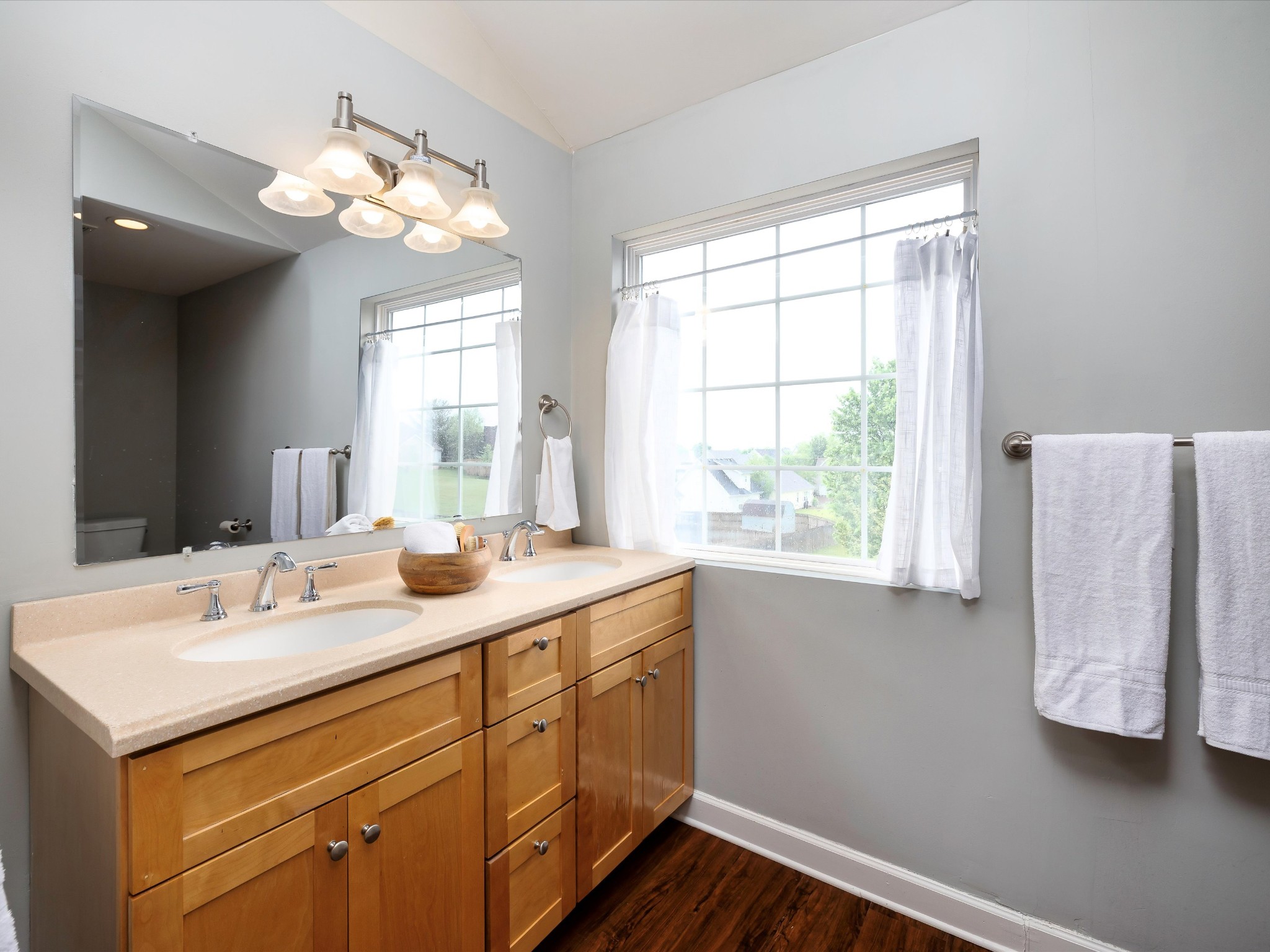 1007 Persimmon Drive Spring Hill, TN 37174 - Photo 31 of 44 a kitchen with a sink cabinets and wooden floor
