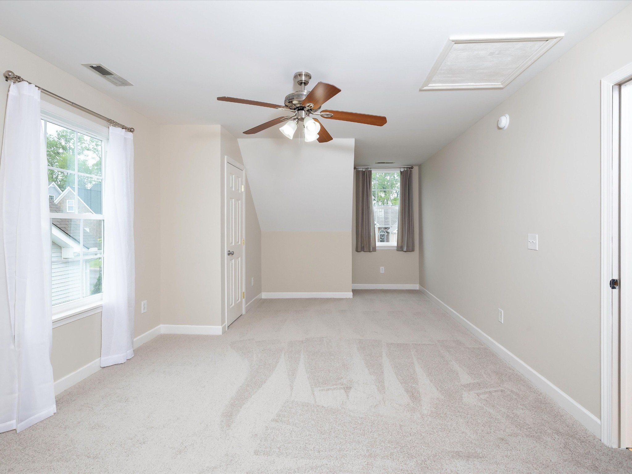 1007 Persimmon Drive Spring Hill, TN 37174 - Photo 32 of 44 a view of a big room with windows and chandelier fan