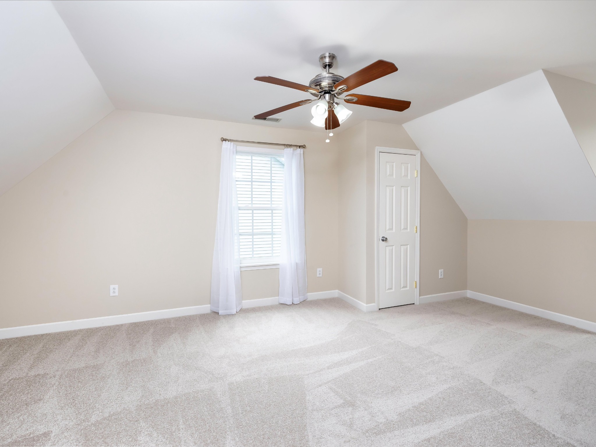 1007 Persimmon Drive Spring Hill, TN 37174 - Photo 33 of 44 an empty room with windows and fan