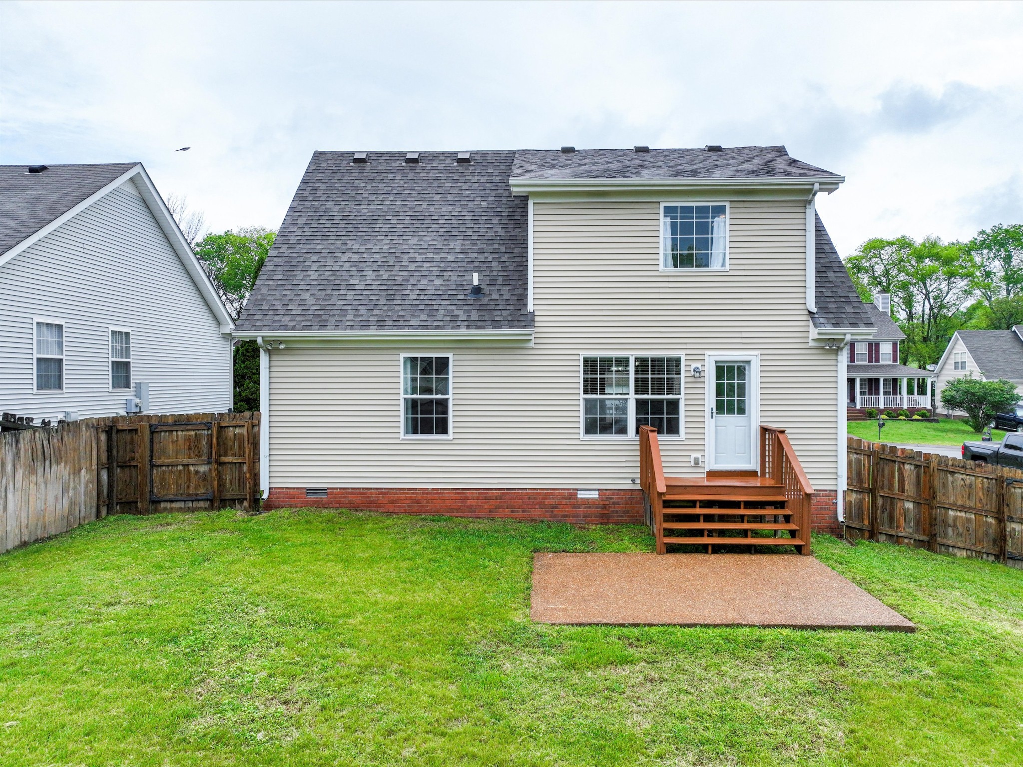 1007 Persimmon Drive Spring Hill, TN 37174 - Photo 35 of 44 a front view of house with yard and outdoor seating