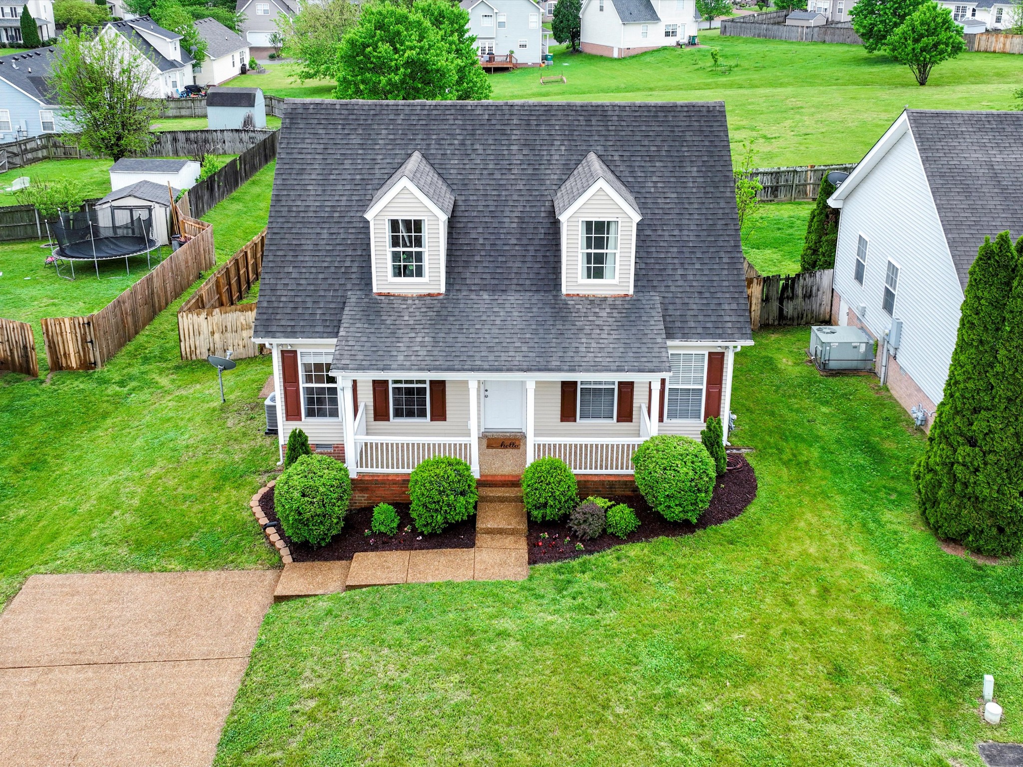 1007 Persimmon Drive Spring Hill, TN 37174 - Photo 4 of 44 a front view of a house with garden