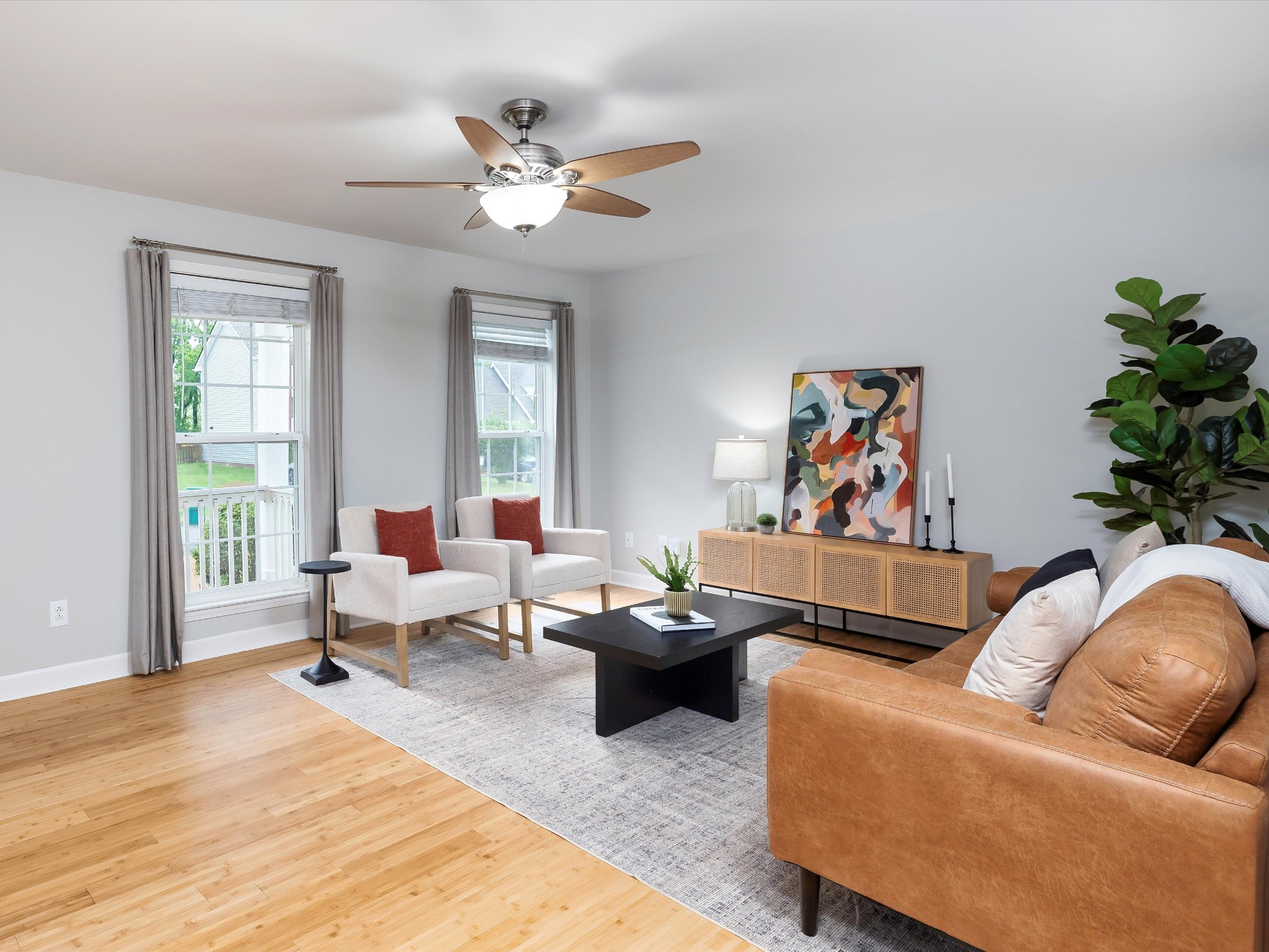 1007 Persimmon Drive Spring Hill, TN 37174 - Photo 8 of 44 a living room with furniture and a potted plant