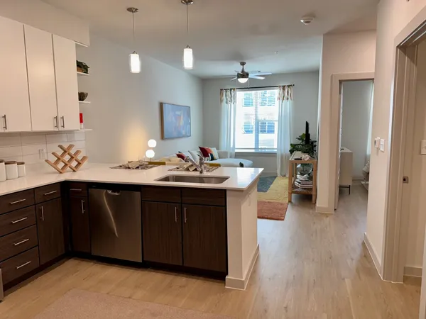 a kitchen with counter top space and sink