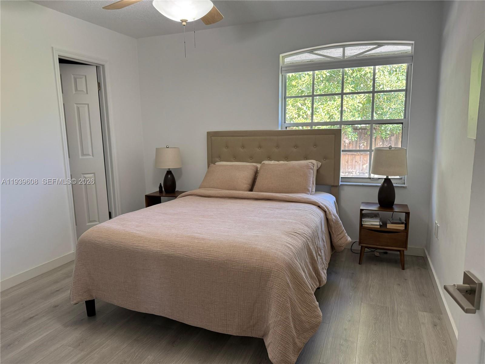 14601 Southwest 99th Avenue Miami, FL 33176 - Photo 13 of 19 a bedroom with a bed and a window