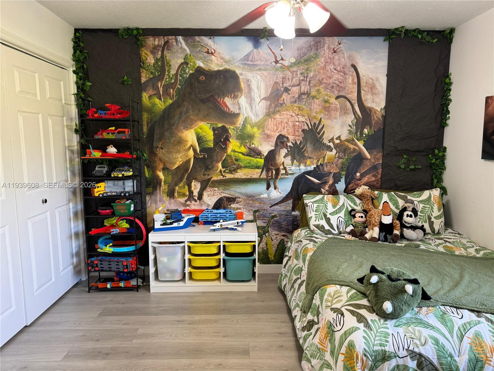 14601 Southwest 99th Avenue Miami, FL 33176 - Photo 14 of 19 a view of a bedroom with baby crib and hanging chair