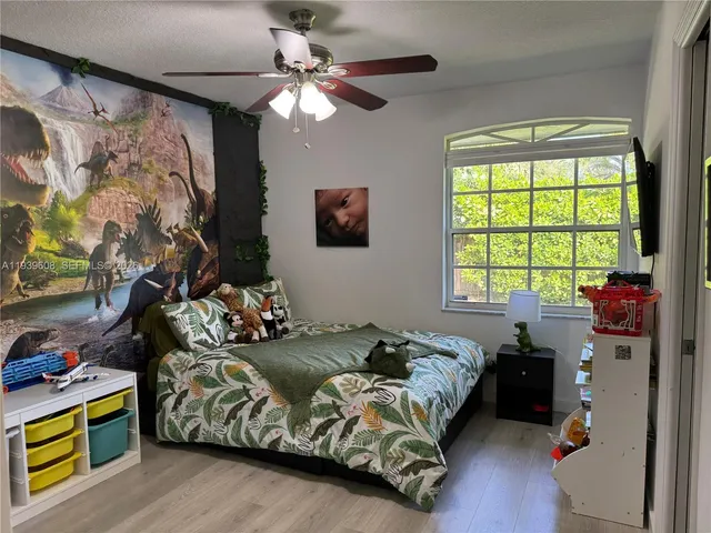 a bedroom with bed and window