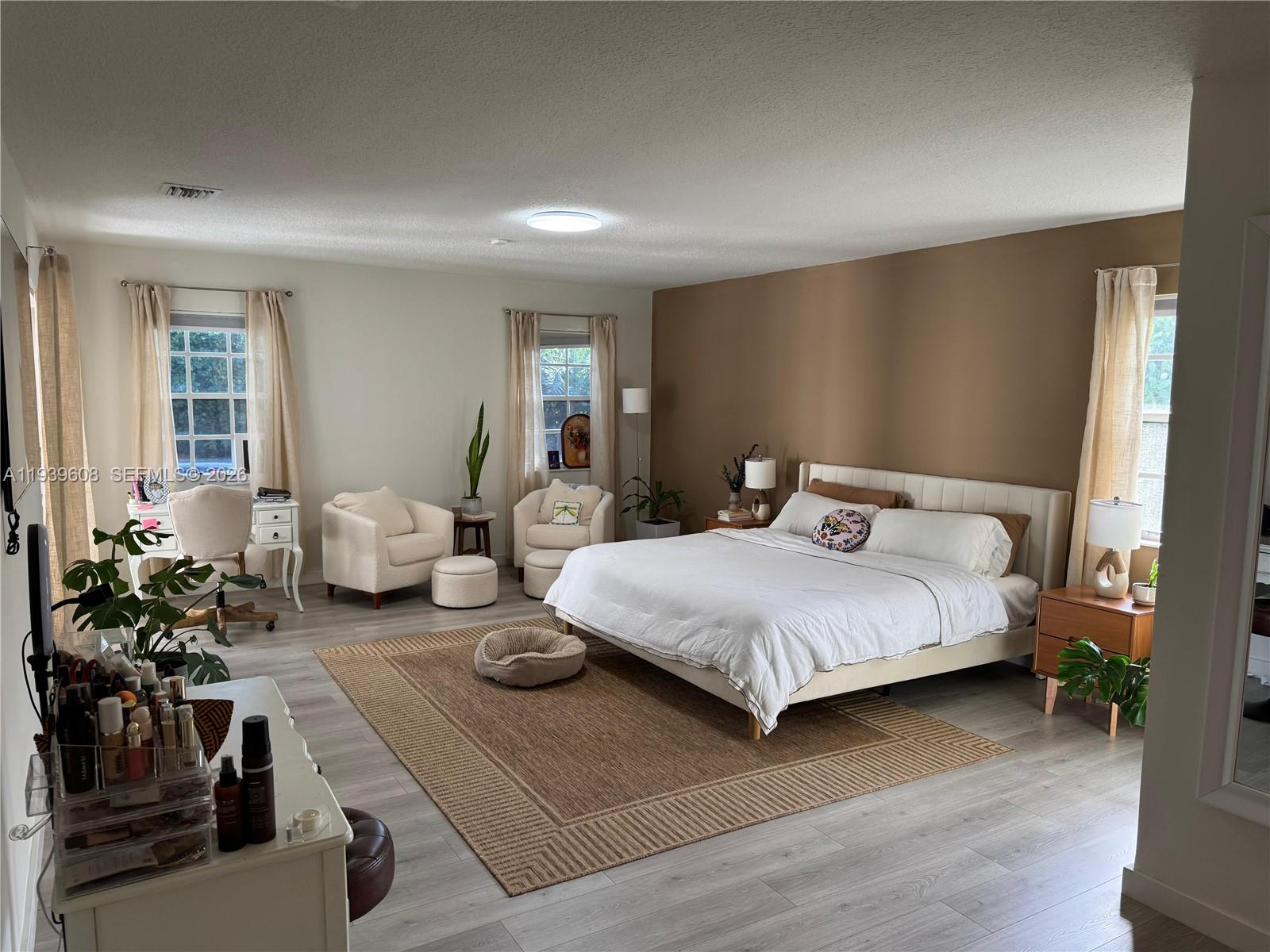 14601 Southwest 99th Avenue Miami, FL 33176 - Photo 19 of 19 a bedroom with bed and a potted plant