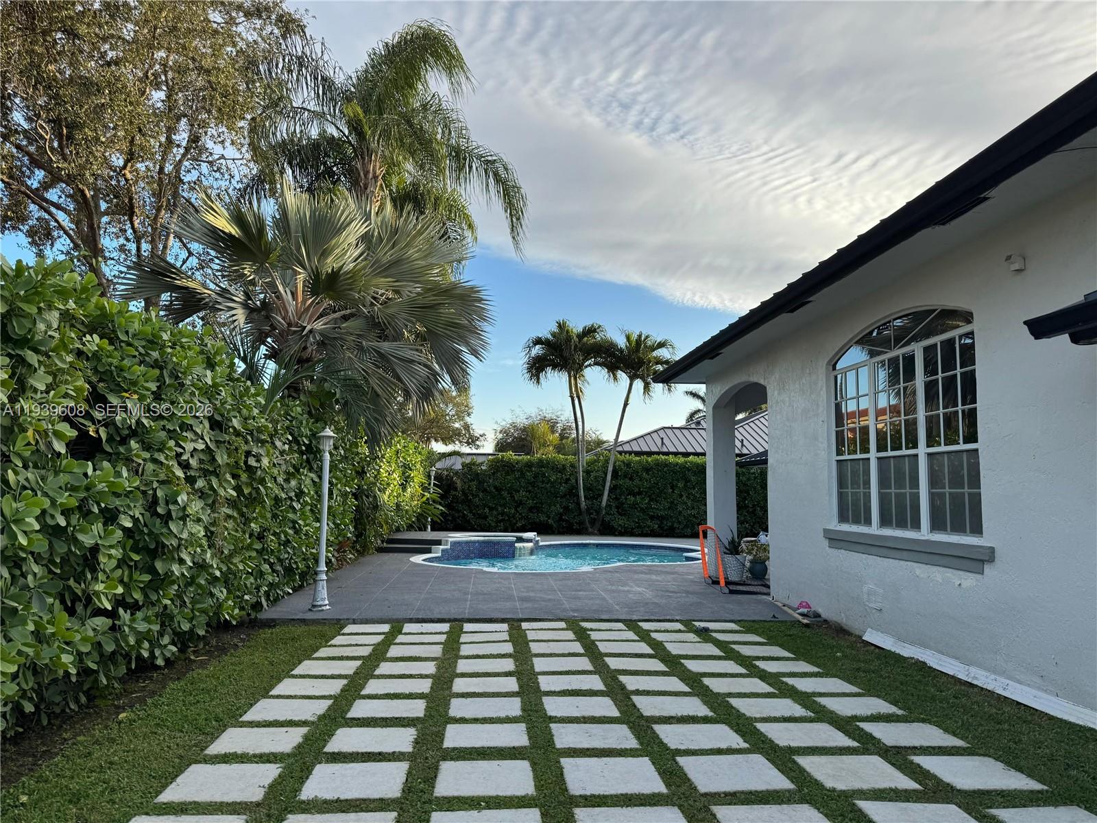 14601 Southwest 99th Avenue Miami, FL 33176 - Photo 9 of 19 a view of a backyard with a garden