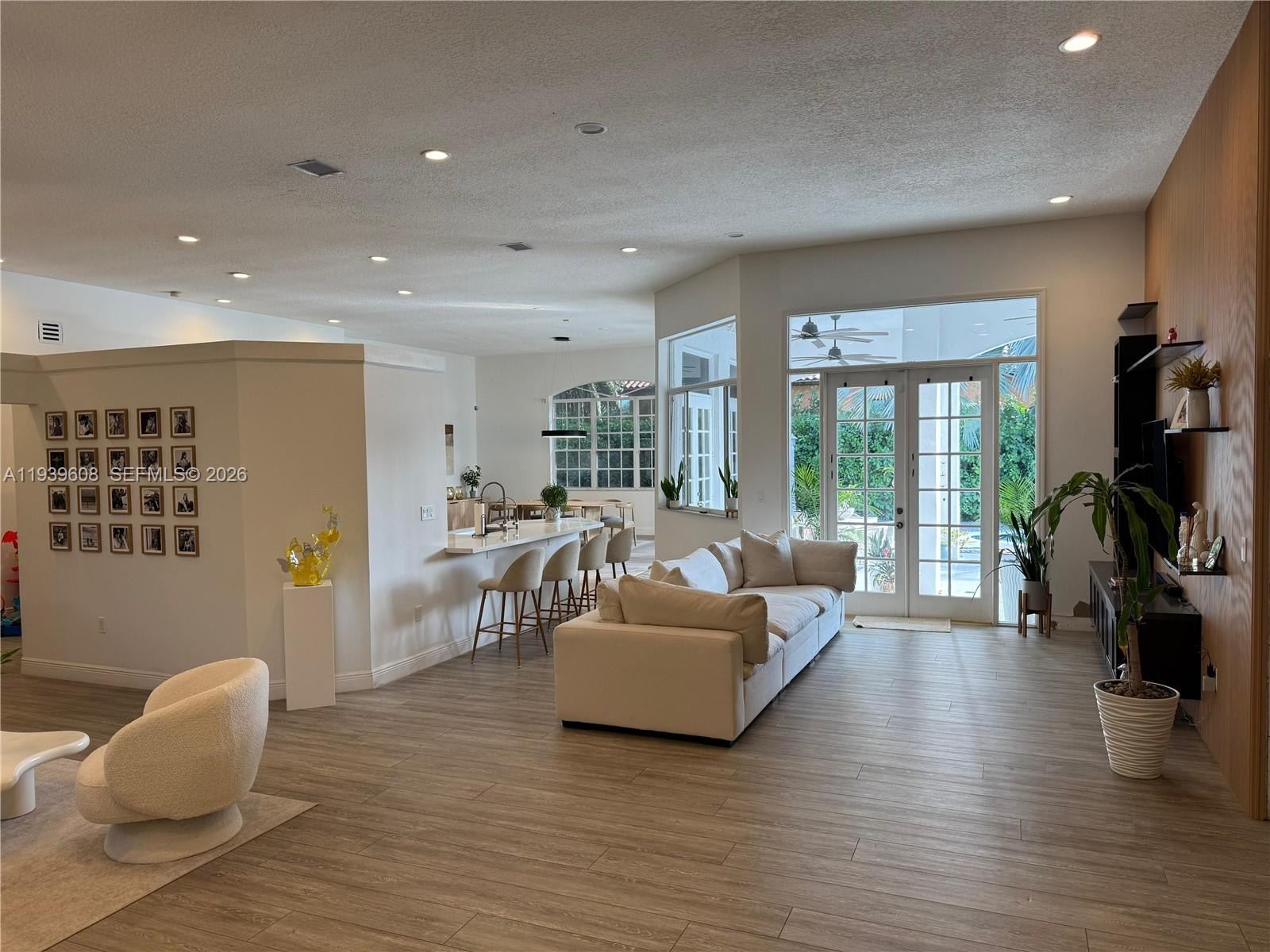 14601 Southwest 99th Avenue Miami, FL 33176 - Photo 10 of 19 a living room with furniture and a flat screen tv