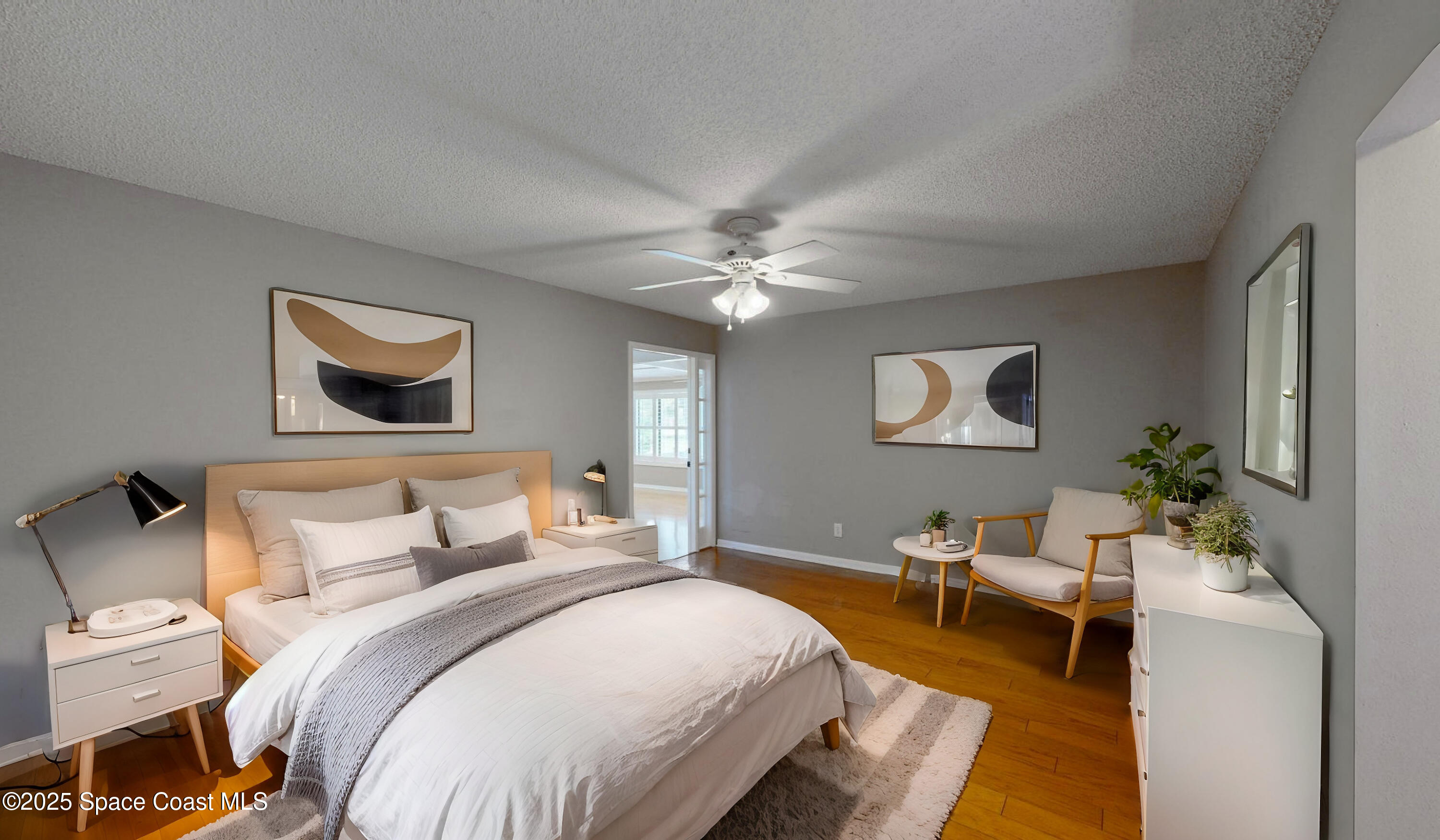 800 Inverness Avenue Melbourne, FL 32940 - Photo 11 of 22 a bedroom with a bed and a chandelier