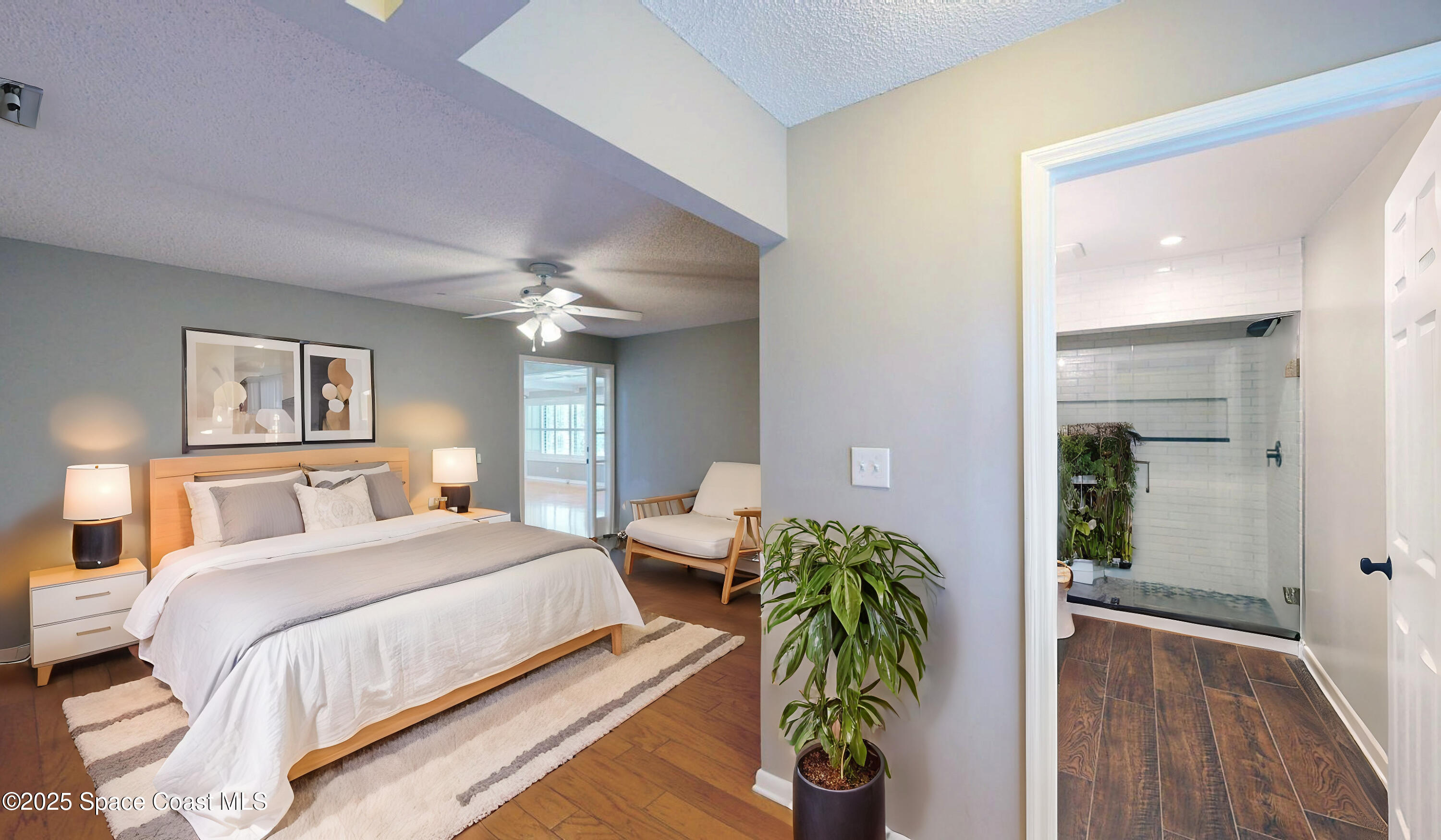 800 Inverness Avenue Melbourne, FL 32940 - Photo 20 of 22 a bedroom with bed and a chandelier