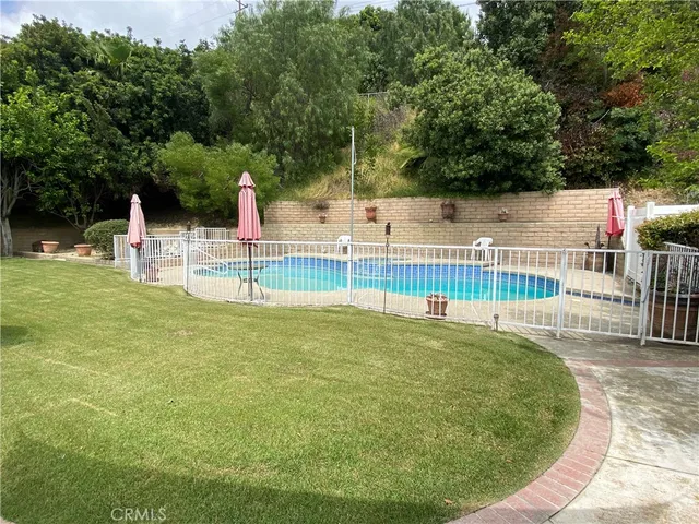 a view of a swimming pool with a patio