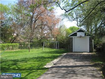 9 Chelten Road Havertown, PA 19083 - Photo 3 of 12 a backyard of a house with plants and large trees
