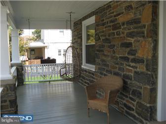 9 Chelten Road Havertown, PA 19083 - Photo 4 of 12 a bathroom with a glass shower door and a window