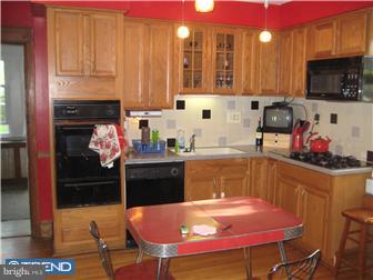 9 Chelten Road Havertown, PA 19083 - Photo 8 of 12 a kitchen with stainless steel appliances granite countertop a stove a refrigerator and a microwave