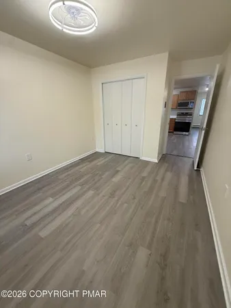 wooden floor in a hall with an entryway