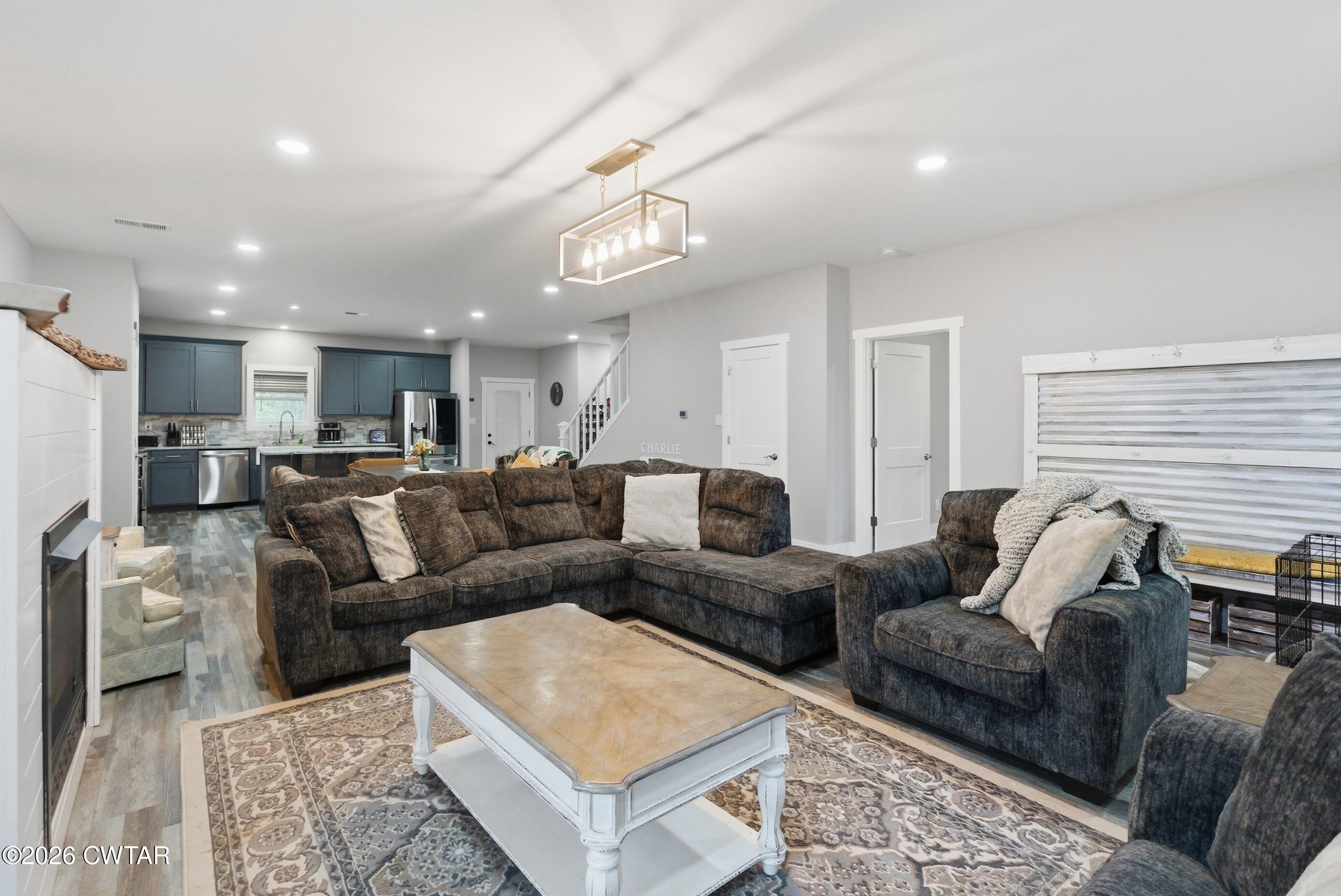 1586 Love Road Bells, TN 38006 - Photo 16 of 61 a living room with furniture and a chandelier