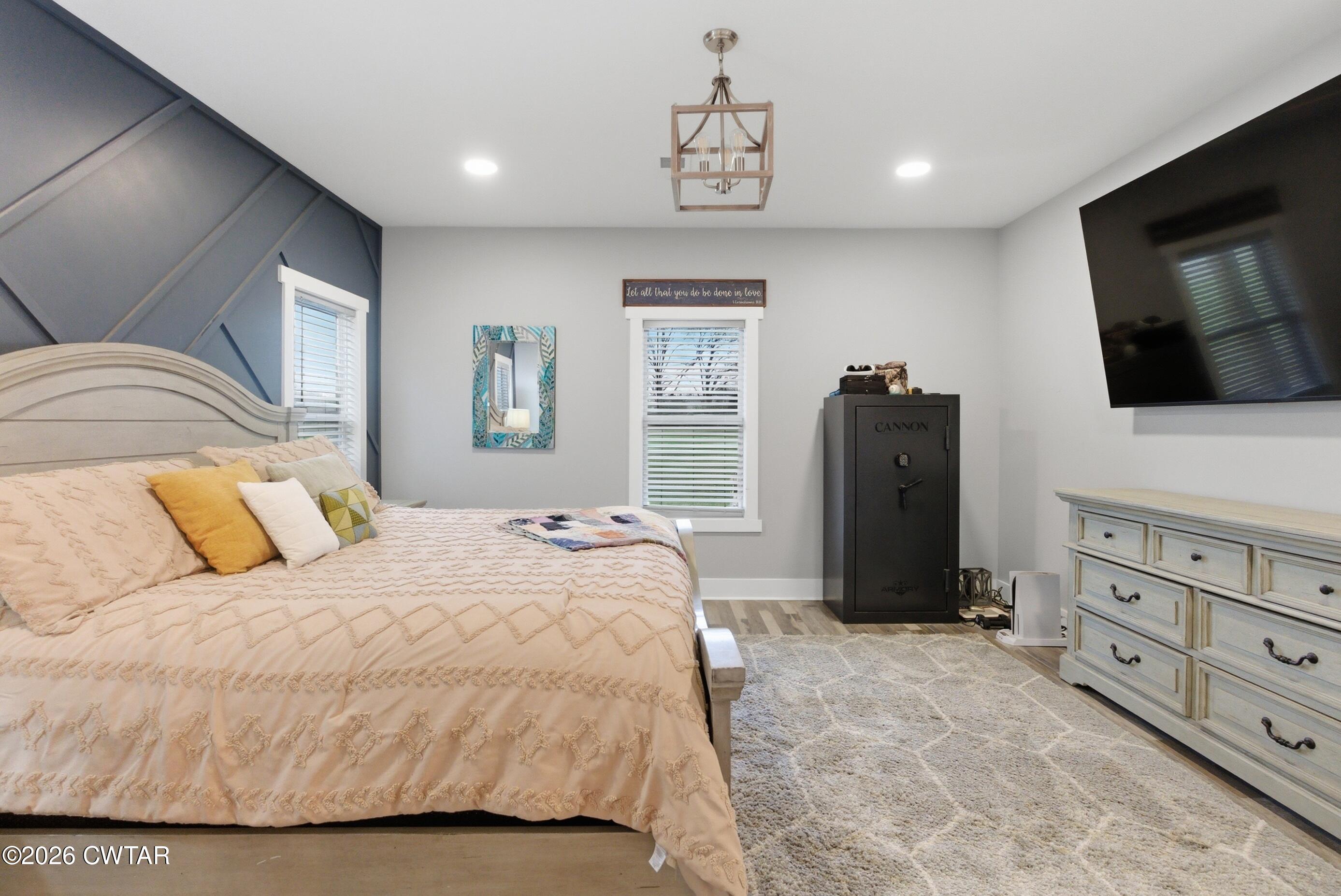 1586 Love Road Bells, TN 38006 - Photo 19 of 61 a bedroom with a bed and a flat screen tv