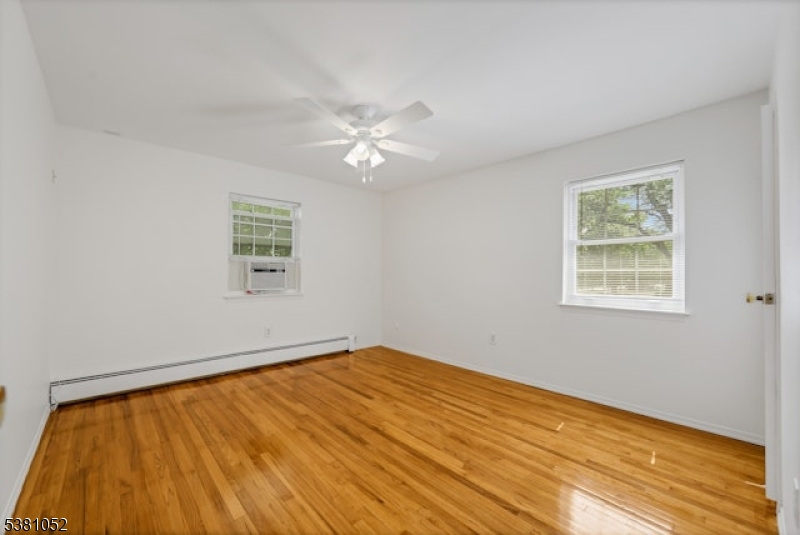 1285 Valley Road Wayne, NJ 07470 - Photo 17 of 33 a view of empty room with wooden floor