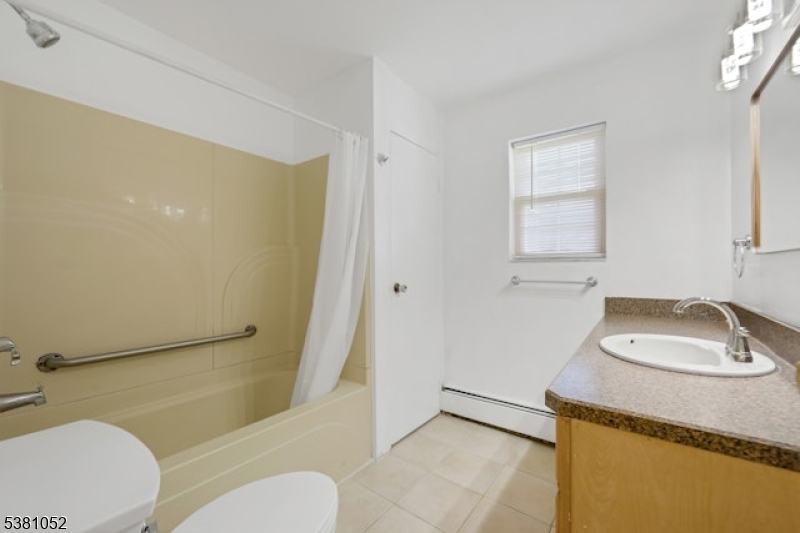 1285 Valley Road Wayne, NJ 07470 - Photo 20 of 33 a bathroom with a sink toilet and shower