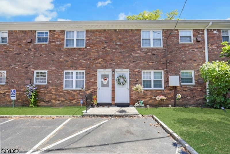 1285 Valley Road Wayne, NJ 07470 - Photo 28 of 33 front view of a brick house with a yard