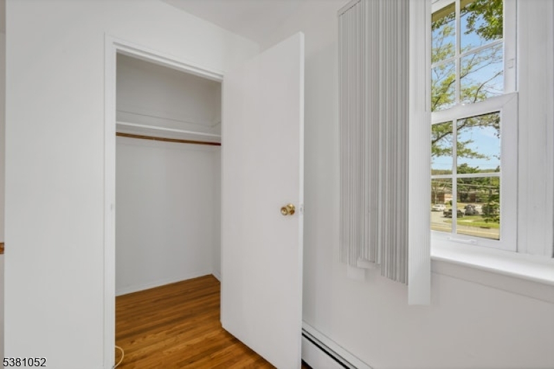 1285 Valley Road Wayne, NJ 07470 - Photo 4 of 33 a view of front door with wooden floor