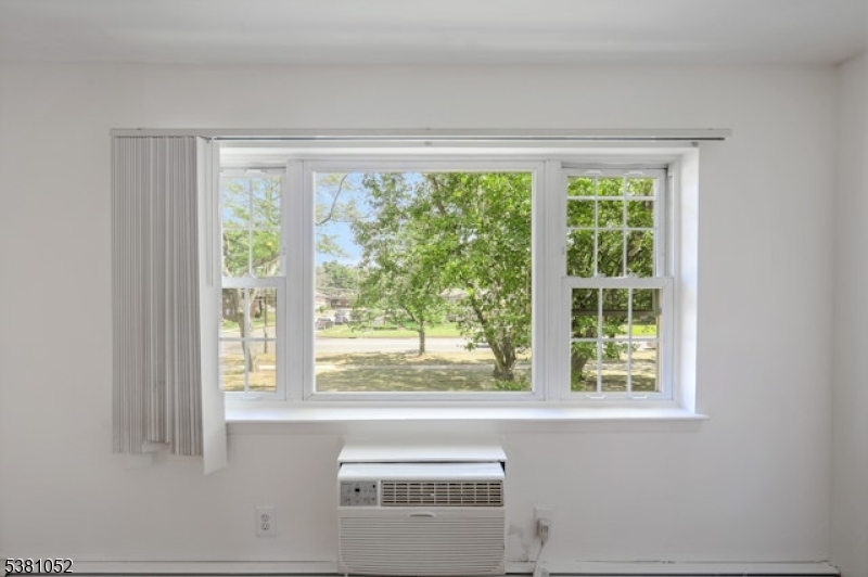 1285 Valley Road Wayne, NJ 07470 - Photo 7 of 33 a living room view with a large window and kitchen view