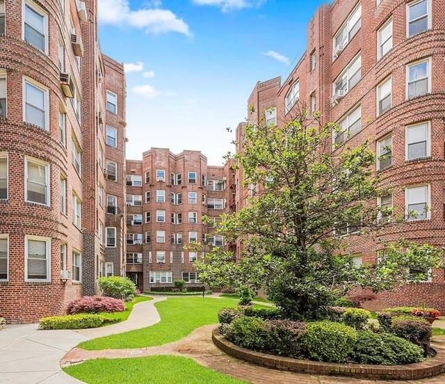 a view of a building with a yard