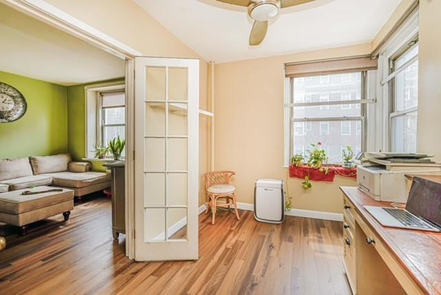 8701 Shore Road, Unit 421 Brooklyn, NY 11209 - Photo 12 of 20 a living room with furniture and a window