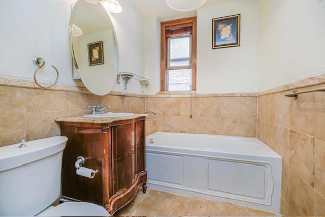 8701 Shore Road, Unit 421 Brooklyn, NY 11209 - Photo 16 of 20 a bathroom with a sink and a mirror