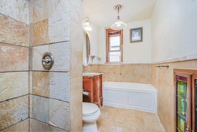 8701 Shore Road, Unit 421 Brooklyn, NY 11209 - Photo 17 of 20 a bathroom with a toilet a sink and a shower