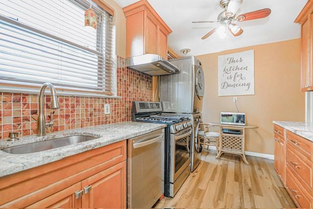 8701 Shore Road, Unit 421 Brooklyn, NY 11209 - Photo 7 of 20 a kitchen with a stove a sink and a microwave