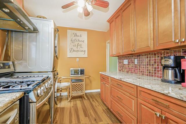 8701 Shore Road, Unit 421 Brooklyn, NY 11209 - Photo 9 of 20 a kitchen with stainless steel appliances granite countertop a stove a sink and a microwave