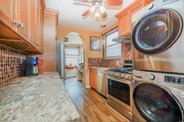 8701 Shore Road, Unit 421 Brooklyn, NY 11209 - Photo 10 of 20 a view of a kitchen with washer and dryer