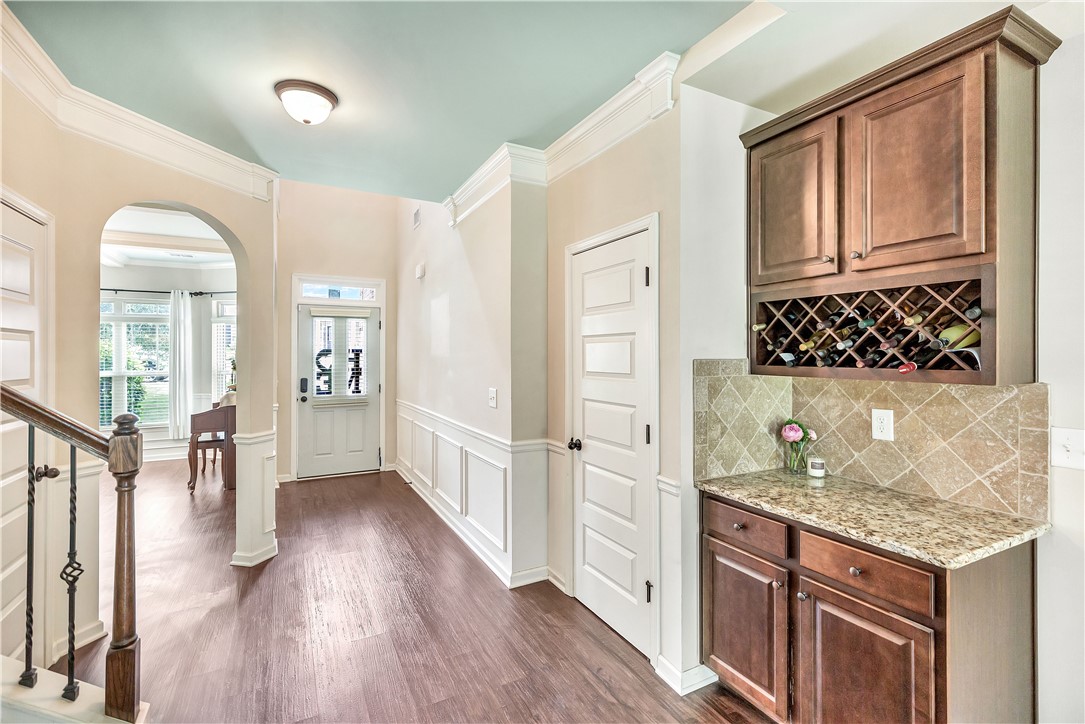 144 Buckland Drive Anderson, SC 29621 - Photo 3 of 48 Enter into a welcoming space featuring rich hardwood flooring and elegant crown molding throughout.