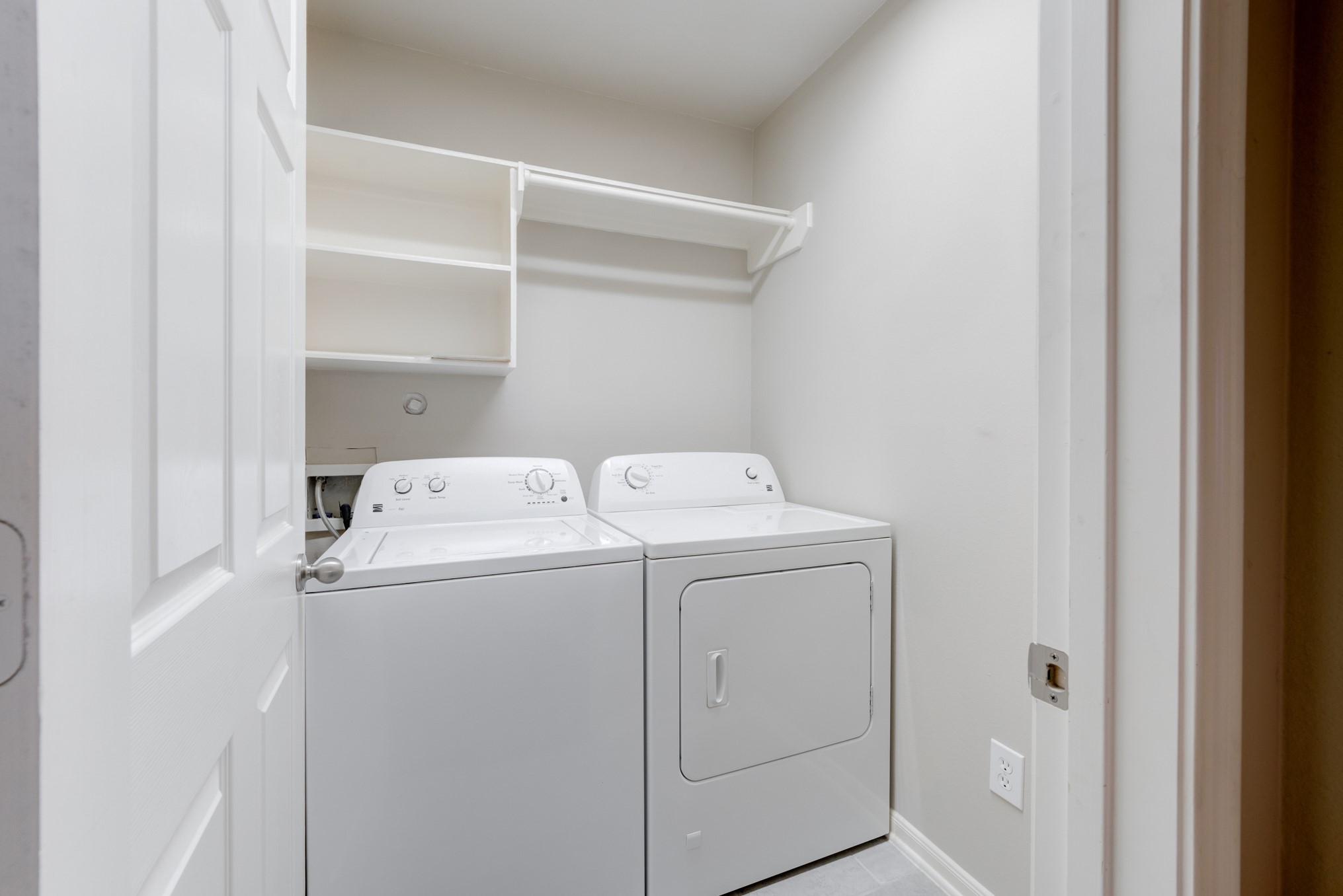 6839 Tammany Manor Lane Spring, TX 77379 - Photo 13 of 25 Laundry room with storage shelves and hanging space