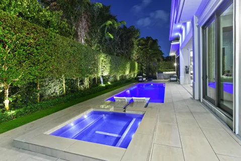 a view of a backyard with trampoline