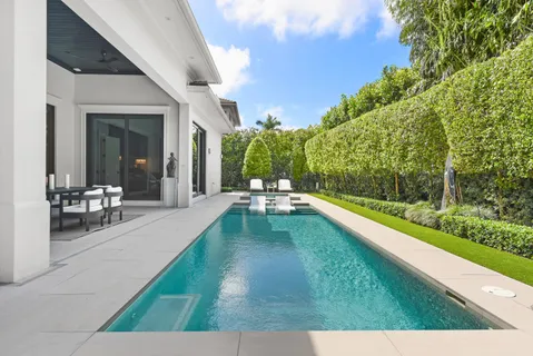 a view of swimming pool with lounge chair