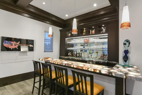 a kitchen with a sink and a stove top oven