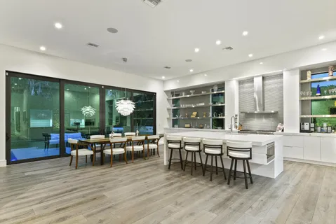 a view of a dining room with furniture window and wooden floor