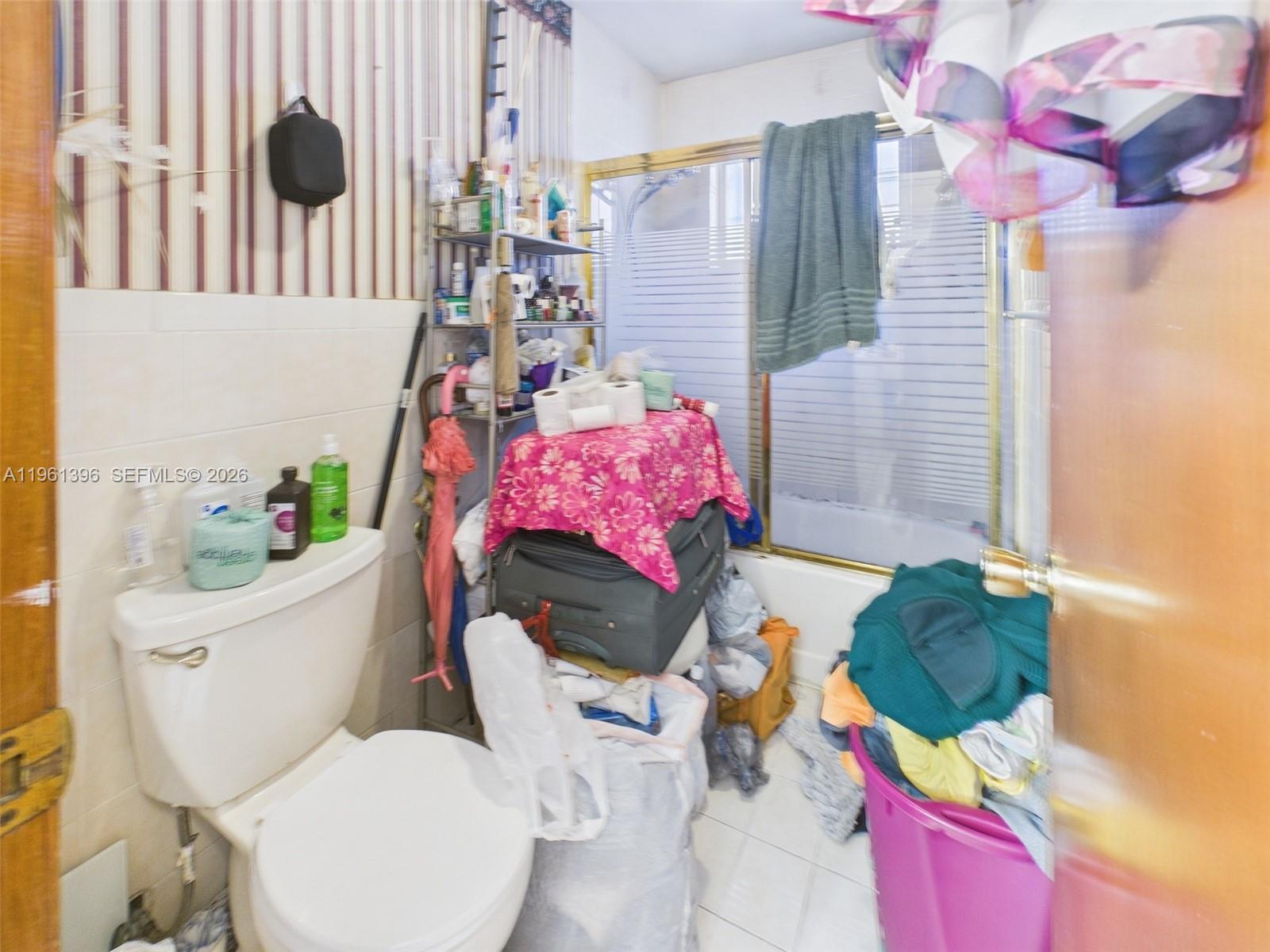 46 Northwest 24th Court Miami, FL 33125 - Photo 17 of 19 a bathroom with a sink toilet and shower