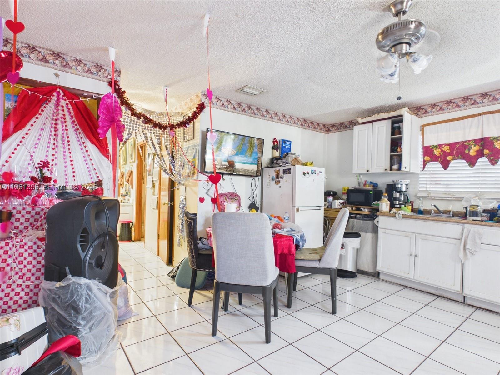 46 Northwest 24th Court Miami, FL 33125 - Photo 18 of 19 a very nice looking room with a lot of stuff and furniture