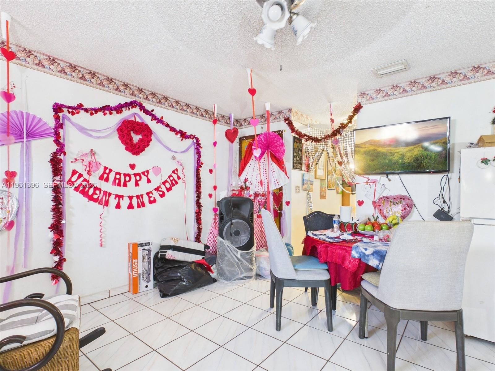 46 Northwest 24th Court Miami, FL 33125 - Photo 19 of 19 a bedroom with furniture and a flat screen tv