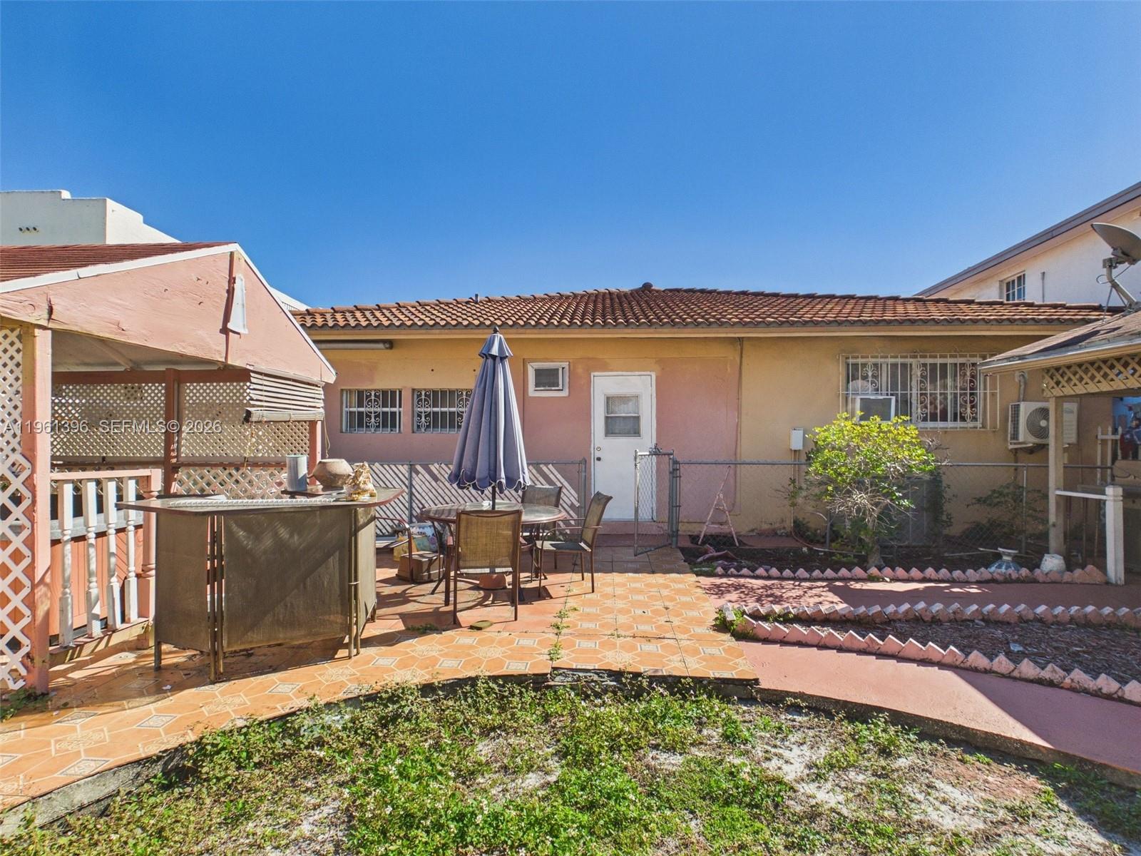 46 Northwest 24th Court Miami, FL 33125 - Photo 3 of 19 a view of a house with backyard and sitting area