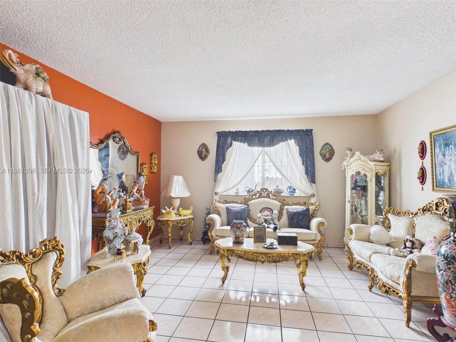 46 Northwest 24th Court Miami, FL 33125 - Photo 6 of 19 a living room with fireplace furniture and a large window