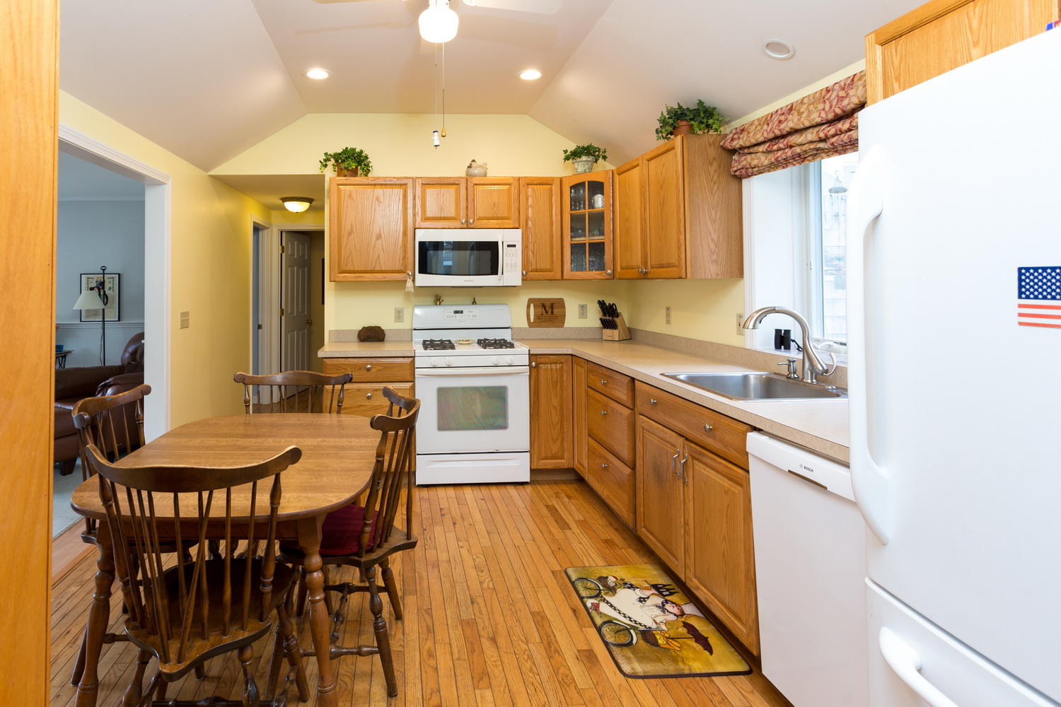 88 Harbor Hills Road Centerville, MA 02632 - Photo 8 of 24 a kitchen with stainless steel appliances kitchen island granite countertop a sink and cabinets