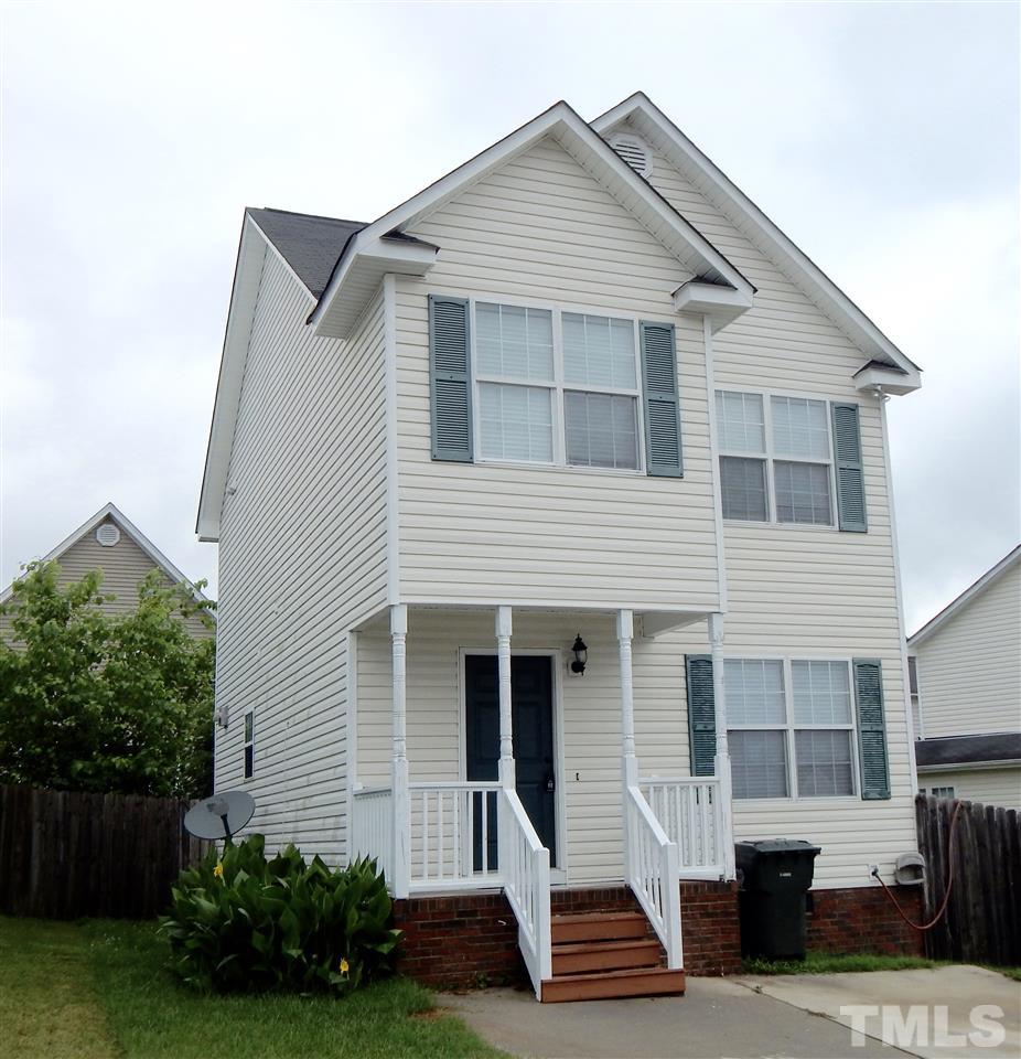 4708 Windbreak Lane Raleigh, NC 27616 - Photo 1 of 13 a front view of a house with garden