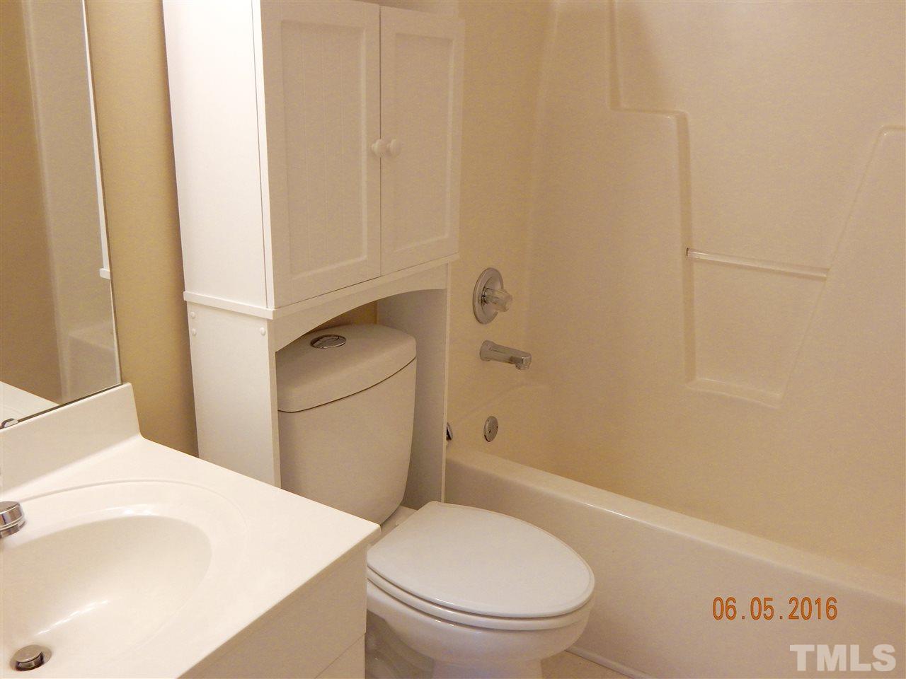 4708 Windbreak Lane Raleigh, NC 27616 - Photo 8 of 13 a bathroom with a toilet and a shower