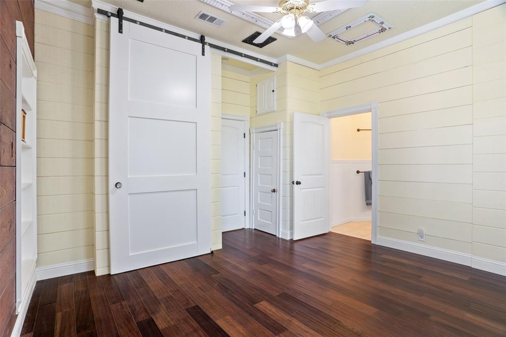 5824 Boone Street Sachse, TX 75048 - Photo 16 of 40 a view of an empty room with wooden floor